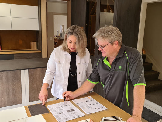 Craig Marshall of STiRLiNG KiTCHENS helps a customer plan and design her dream kitchen