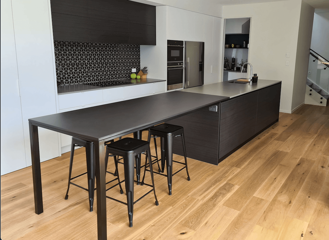 STiRLiNG KiTCHENS project in St. Heliers, Auckland. Custom made kitchen bench and dining table with Dekton surfaces